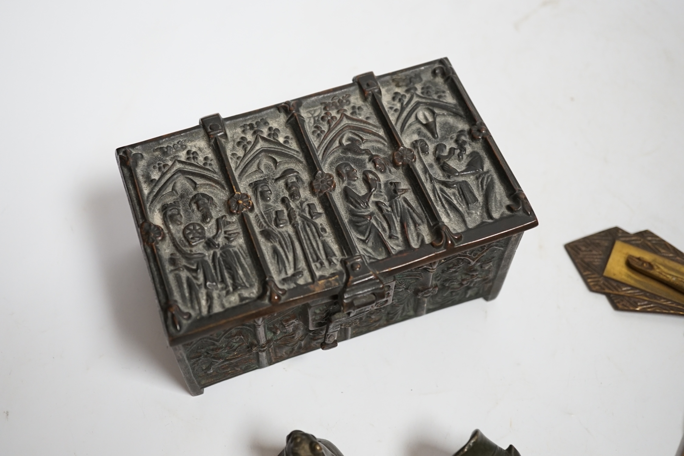 A bronze gothic casket, two Burmese bronze weights and a cast brass crucifix, 31.5cm